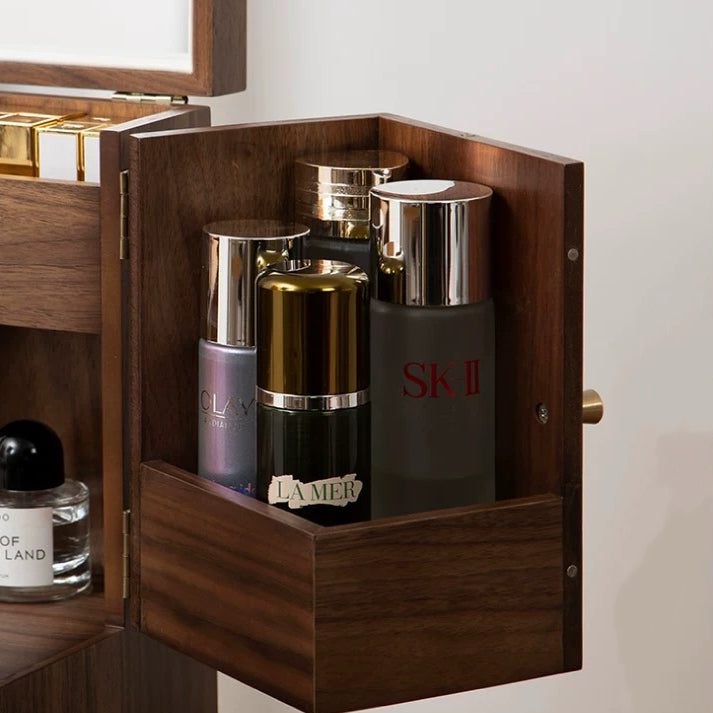 Wooden jewelry box with skincare products including SK-II and Olay.